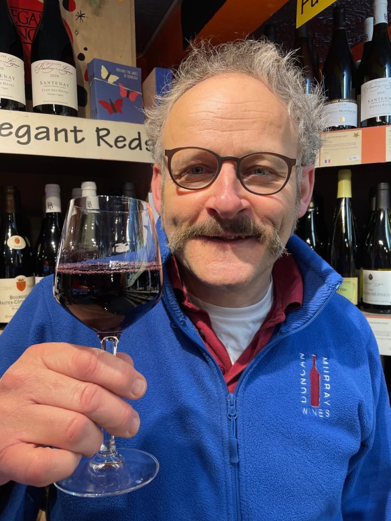 Duncan Murray holding a glass of one of his wondrous wines