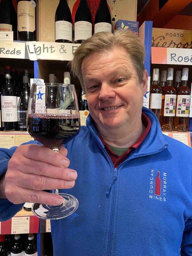 Nick holding a glass of one of Duncan Murray Wines most wondrous wines