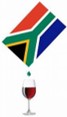 Image shows red wine being poured into a glass from a South African flag