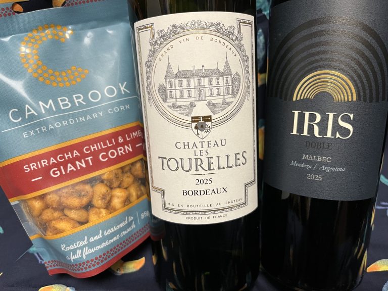 Image shows the 2 tasting wines and giant corn on this Saturday's Free Tasting.